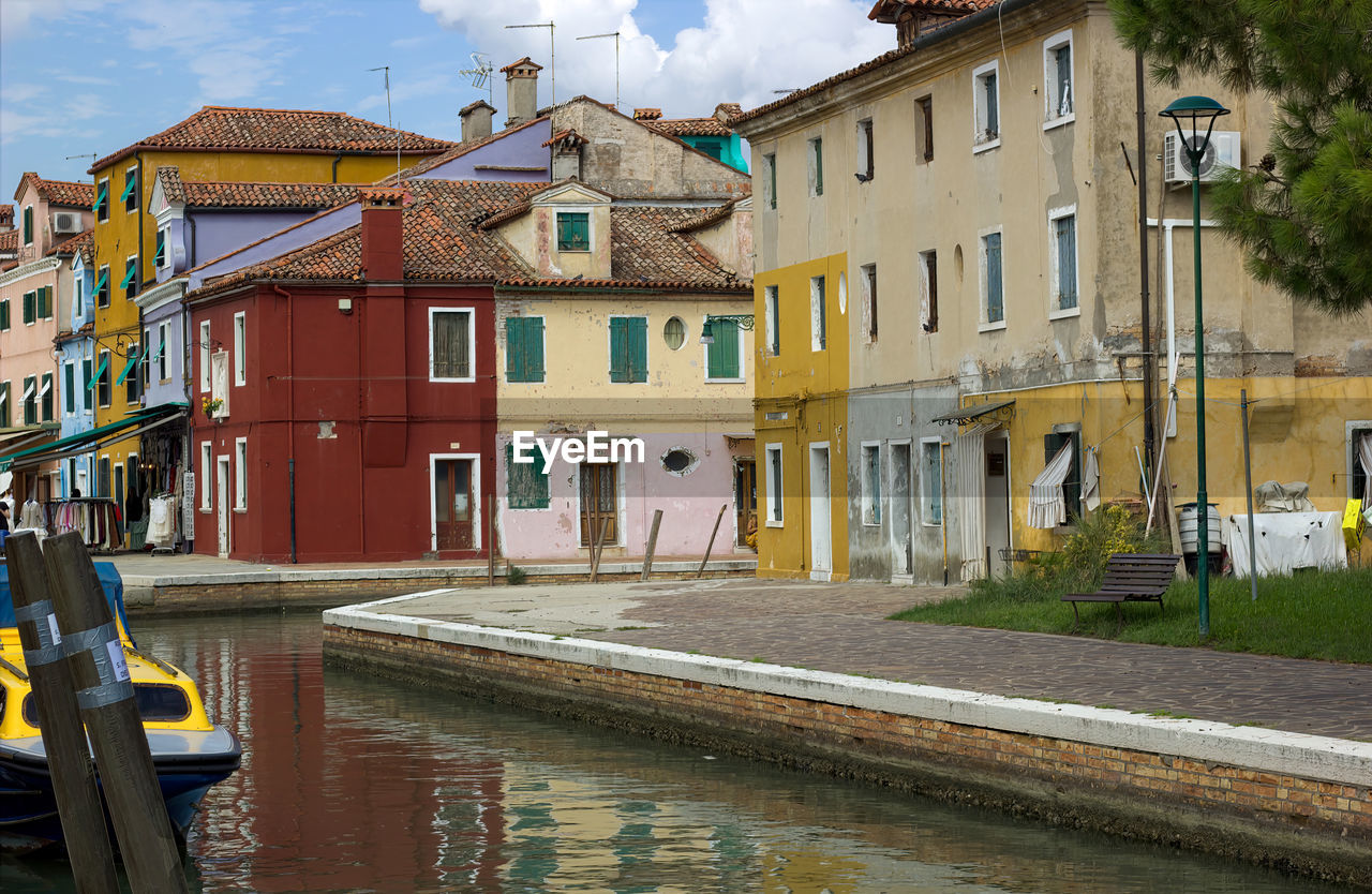 Colorful canal views in burano village, venice, italy