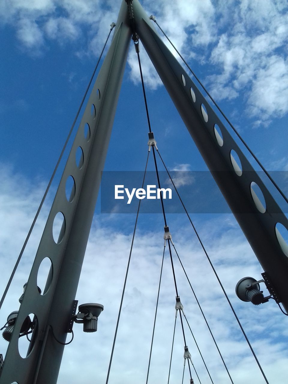 LOW ANGLE VIEW OF BRIDGE AGAINST CLOUDY SKY