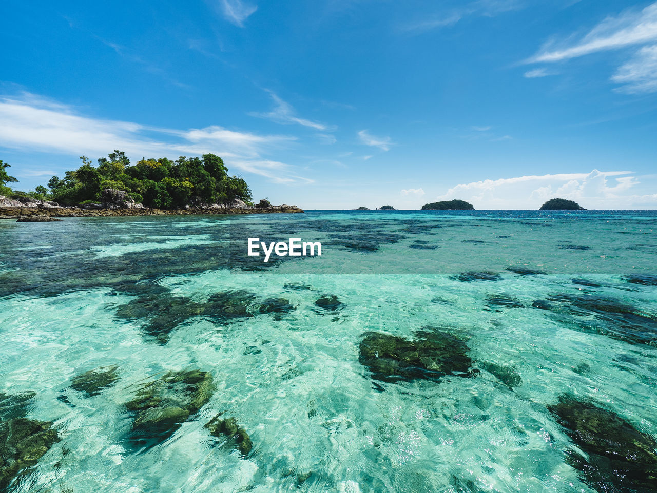 water, sea, land, sky, scenics - nature, ocean, beauty in nature, tropical climate, beach, nature, blue, environment, travel destinations, travel, island, turquoise colored, tranquility, lagoon, vacation, trip, holiday, idyllic, landscape, tranquil scene, reef, cloud, coast, coral, sand, seascape, tourism, shore, no people, wind wave, outdoors, body of water, summer, tree, sea life, coastline, rock, underwater, water sports, islet, palm tree, day, relaxation, tropical tree, bay of water, sunlight, transparent, bay, horizon over water, wave, tropics, horizon, sports, undersea, sunny, exoticism, motion