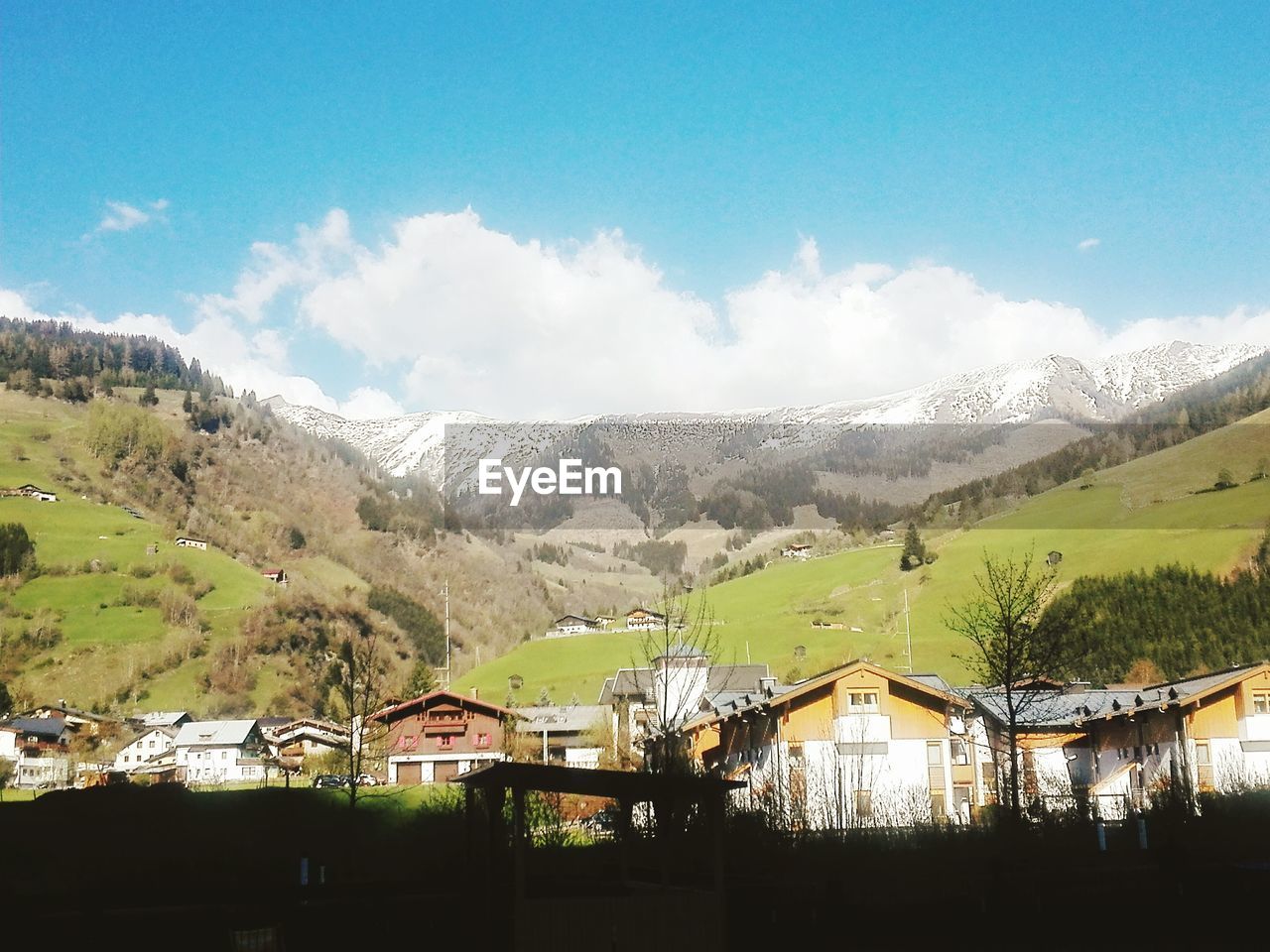 Houses on mountain against sky