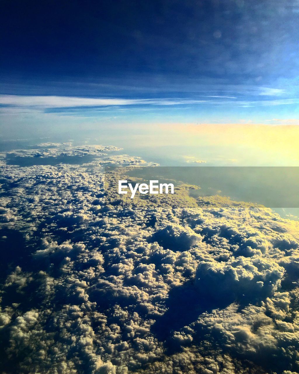 AERIAL VIEW OF CLOUDY SKY OVER LANDSCAPE