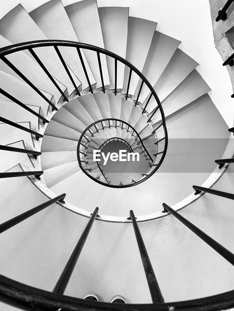 LOW ANGLE VIEW OF SPIRAL STAIRCASE OF BUILDING