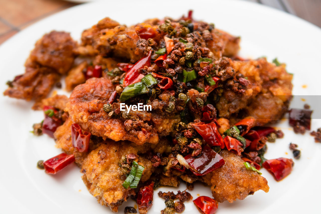 food and drink, food, meat, plate, dish, fried food, meal, healthy eating, produce, cuisine, freshness, no people, vegetable, close-up, asian food, wellbeing, indoors, dinner, restaurant, fried, chicken meat, table, roasted, serving size, gourmet, animal, chicken, herb