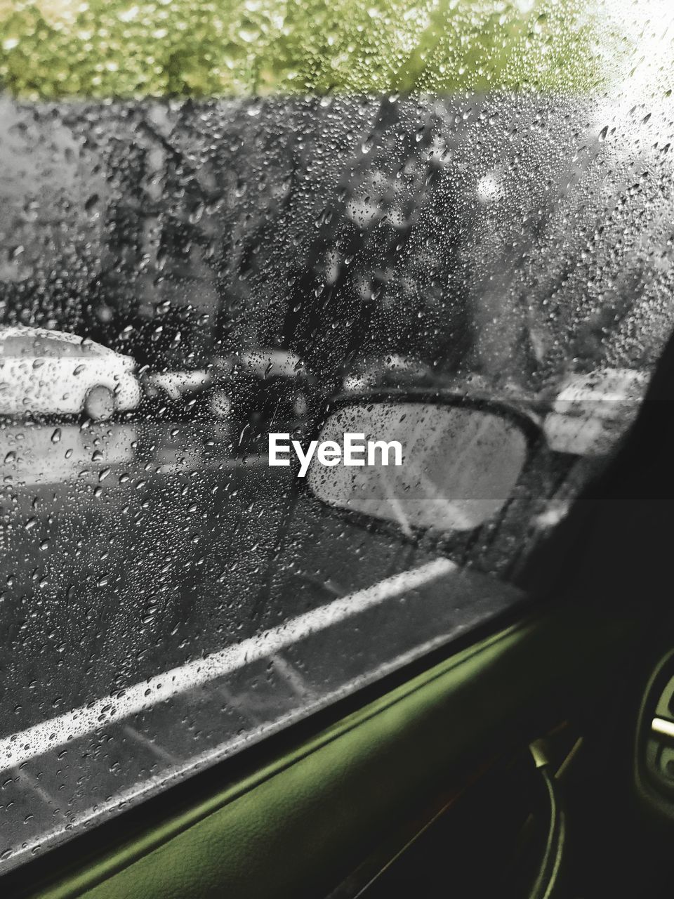 Wet car window during rainy season