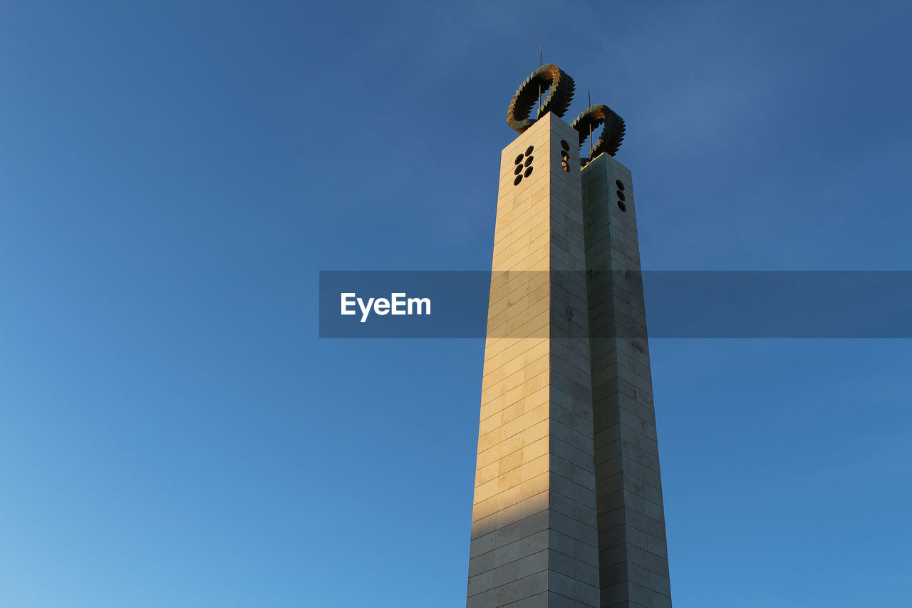 LOW ANGLE VIEW OF TOWER AGAINST CLEAR SKY