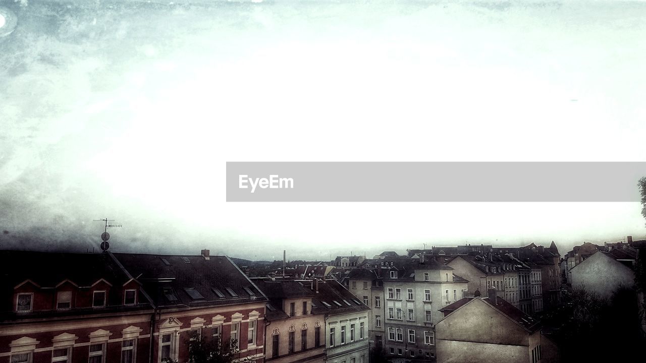 HOUSES AGAINST CLEAR SKY