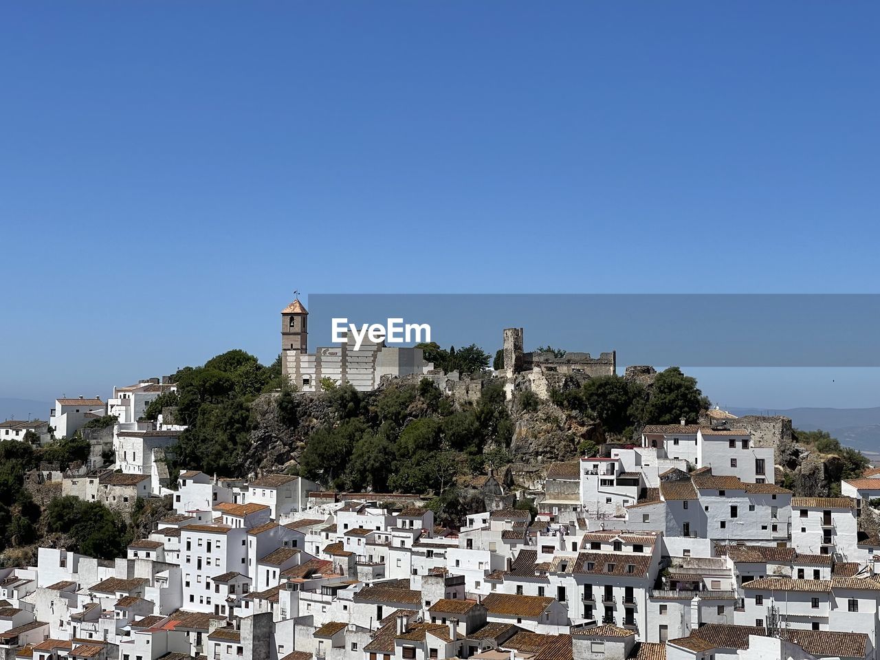 The white village of casares in southern spain against clear blue sky