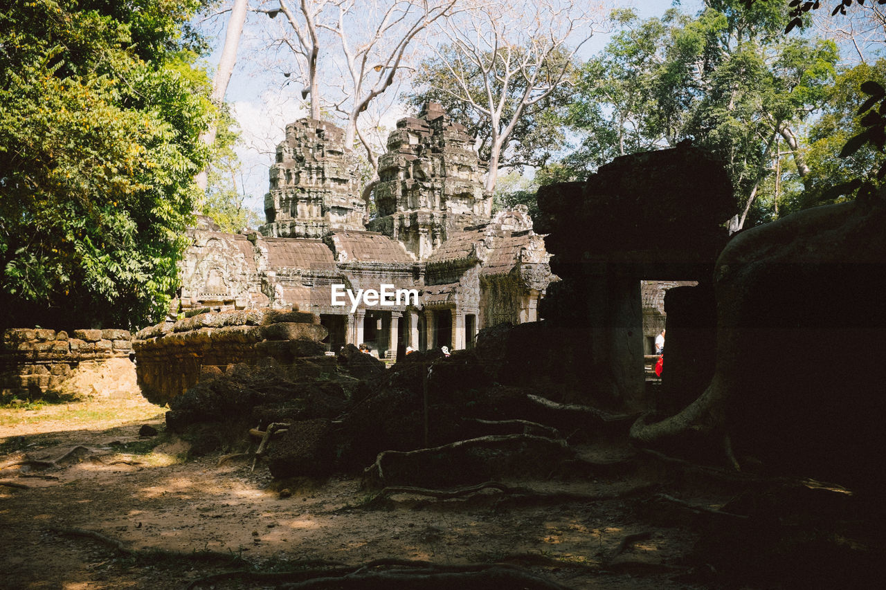 Exterior of ancient temple against sky