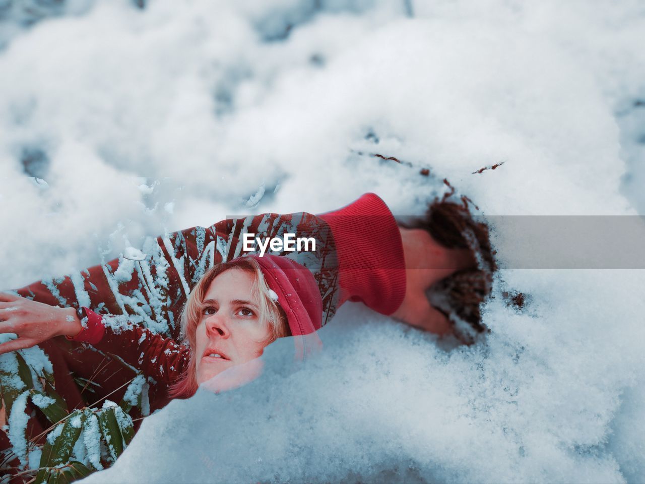 snow, winter, cold temperature, nature, one person, clothing, lying down, red, adult, leisure activity, young adult, portrait, mountain, day, holiday, women, warm clothing, sports, outdoors, freezing, vacation, environment, lifestyles, fun, blue, emotion, trip, happiness, enjoyment, child, beauty in nature, smiling, looking at camera, hat, relaxation, female