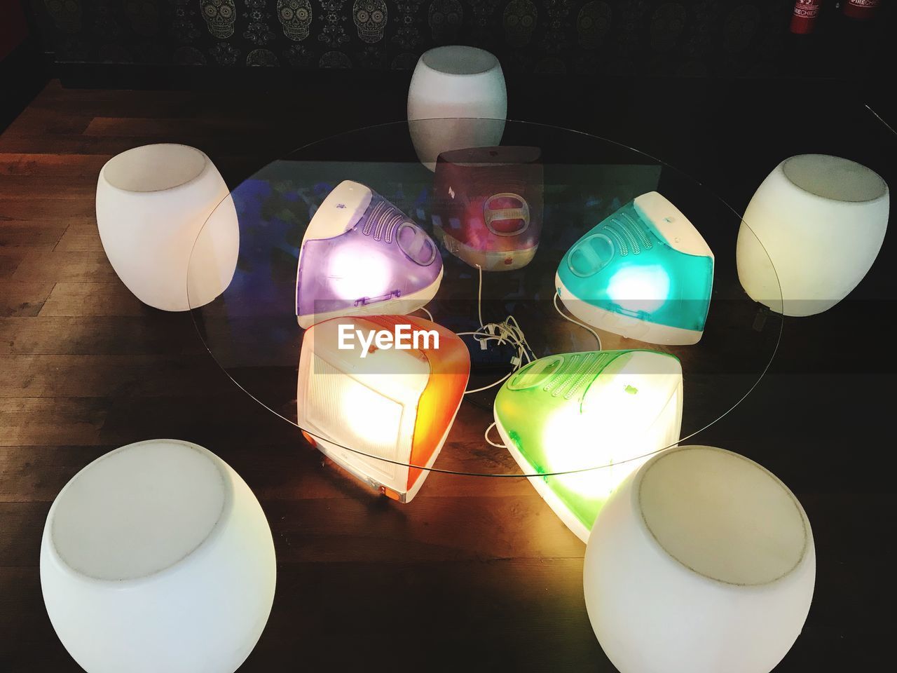 HIGH ANGLE VIEW OF ILLUMINATED LAMPS ON TABLE