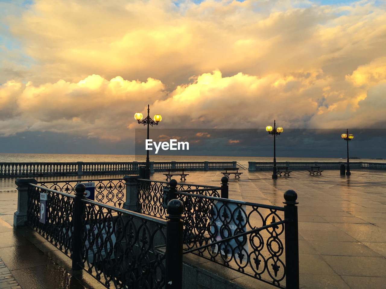 PIER ON SEA AGAINST SKY AT SUNSET