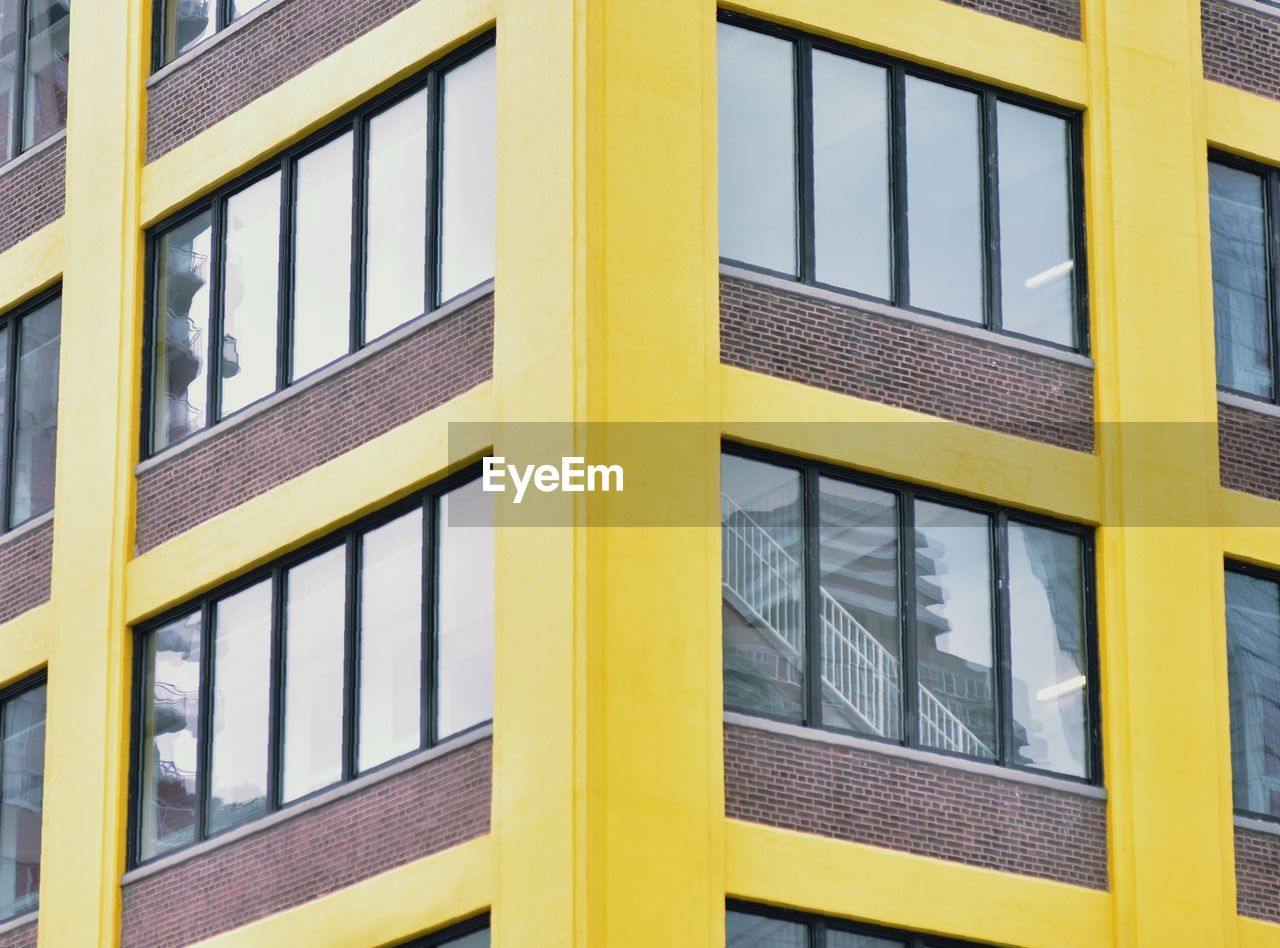 CLOSE-UP OF YELLOW WINDOWS