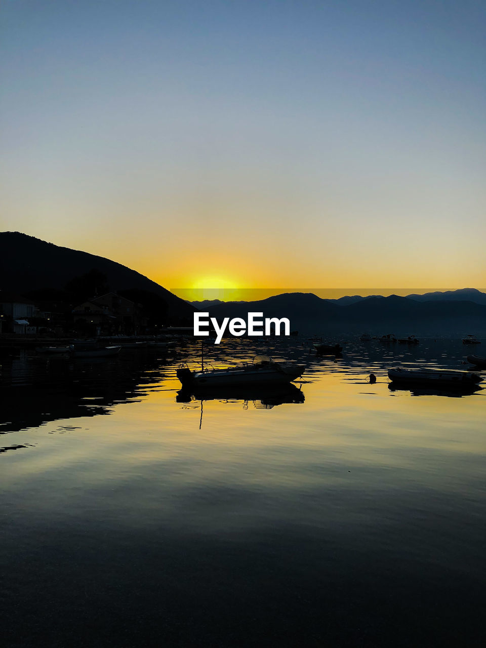 SCENIC VIEW OF LAKE DURING SUNSET