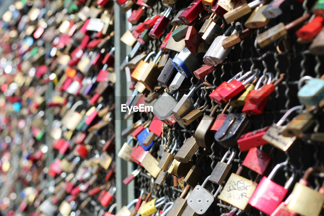 Close-up of padlocks on railing