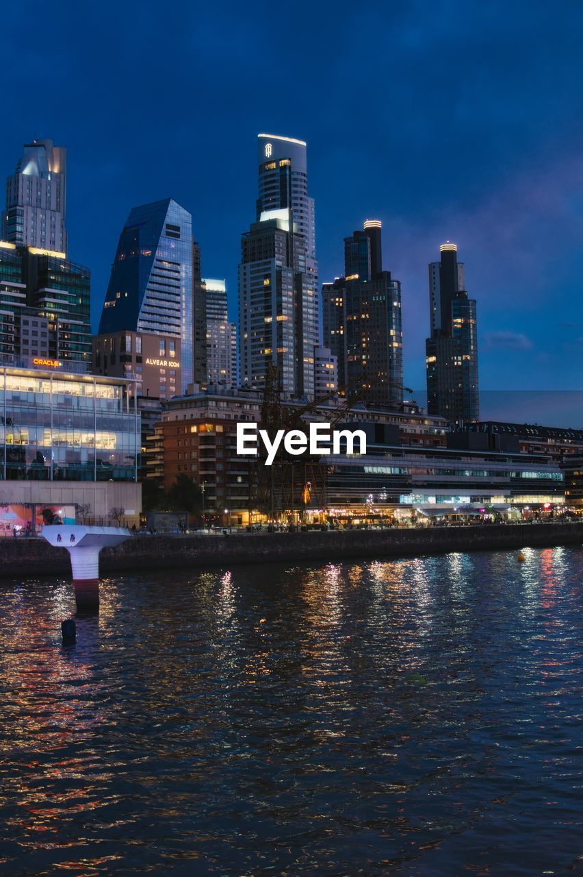 view of city at waterfront against sky