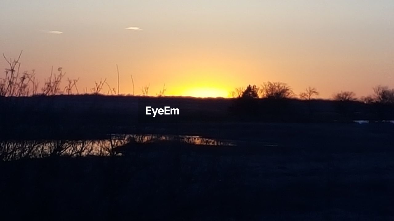 SUNSET OVER LANDSCAPE