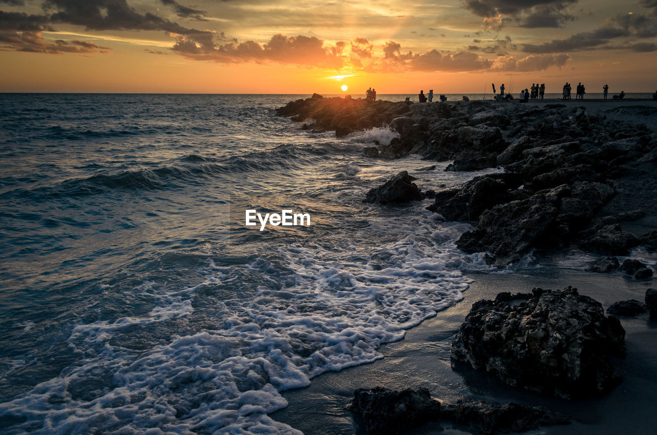 View of beach at sunset