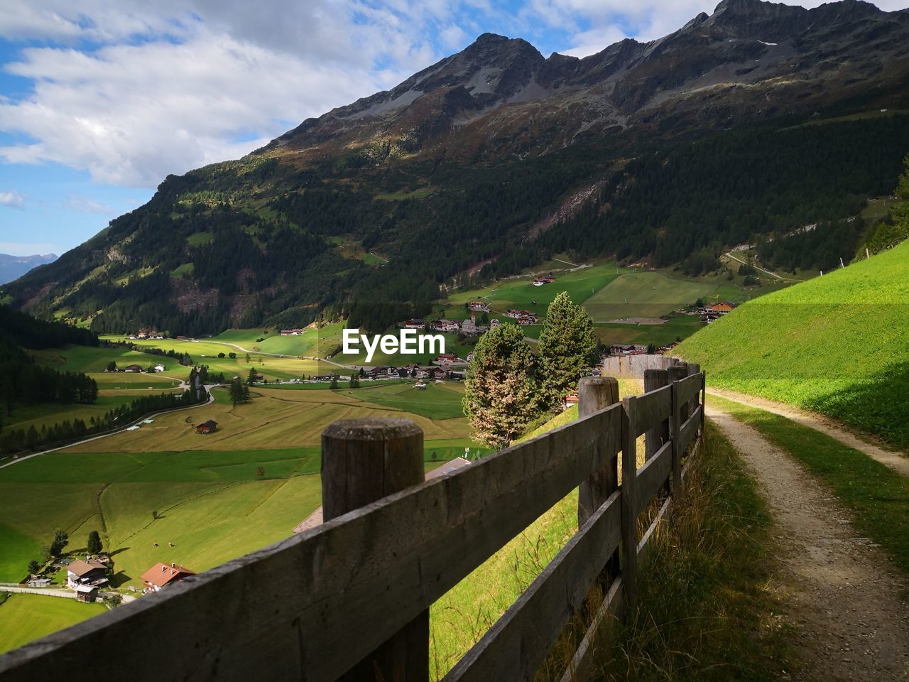 Scenic view of landscape and mountains against sky