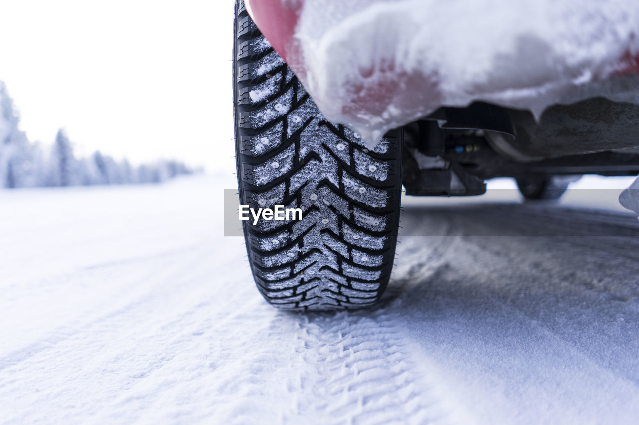 Close-up of snow covered tyre
