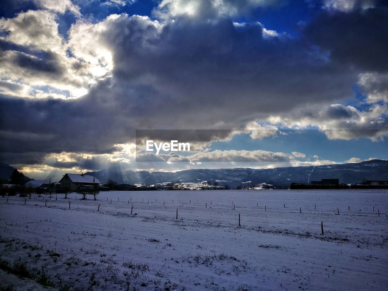 Scenic view of snow field against sky