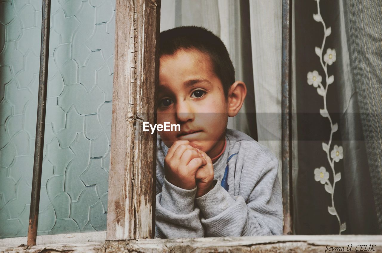 CUTE BABY BOY SITTING ON TABLE