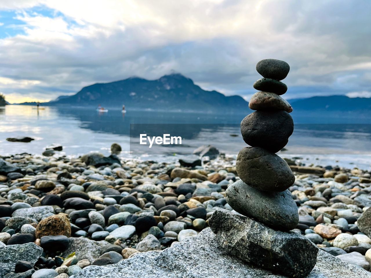 Rock balancing at beach with scenic view