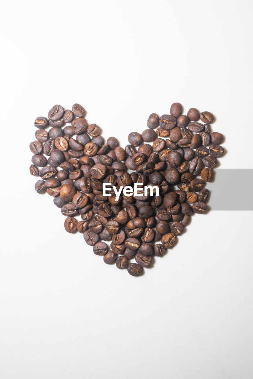 close-up of coffee beans against white background