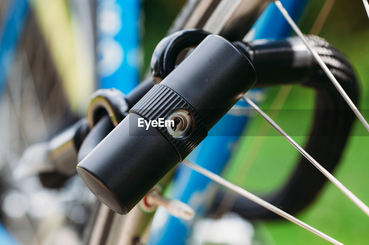 Close-up of lock on bicycle wheel