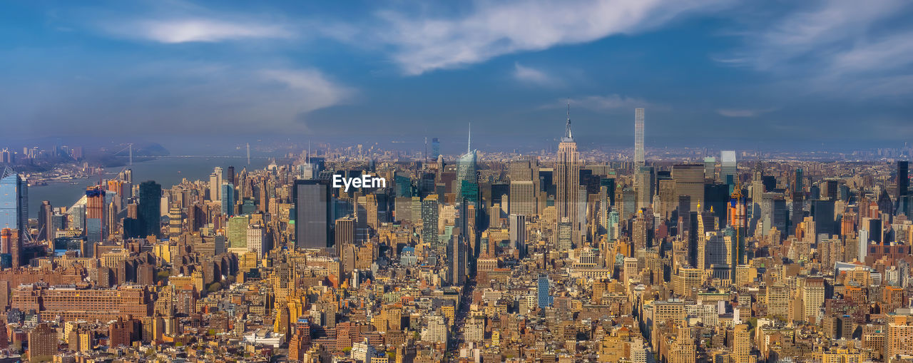 high angle view of city buildings against sky