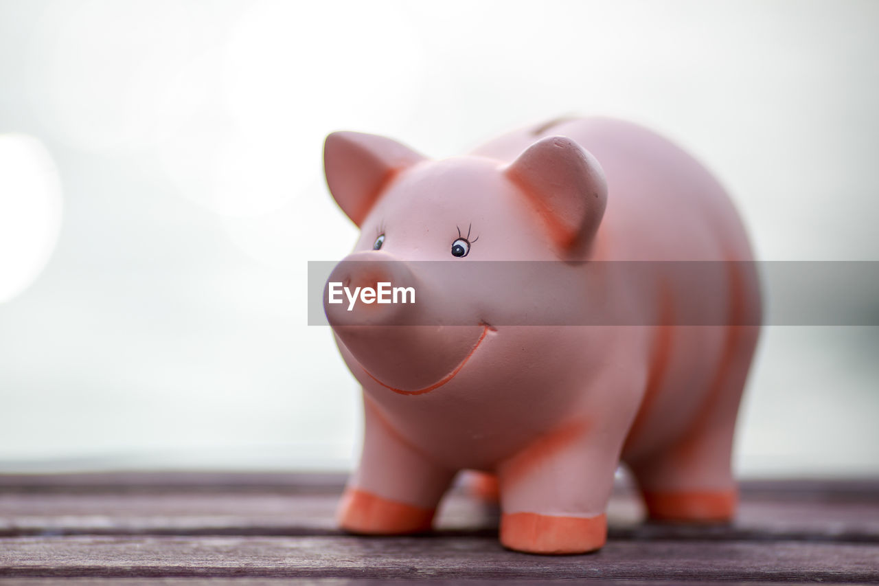 Close-up of piggy bank on table