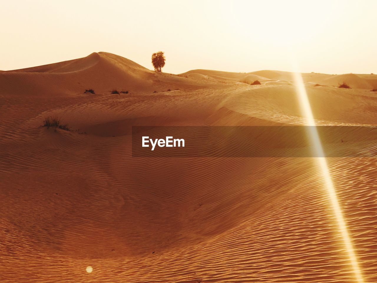 SAND DUNES IN DESERT AGAINST SKY