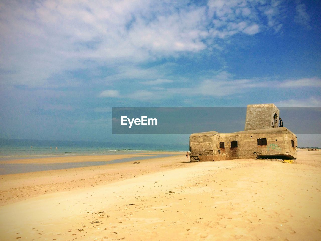 CASTLE BY SEA AGAINST SKY