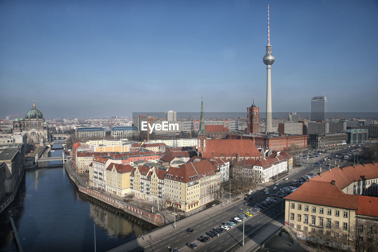 RIVER WITH CITYSCAPE IN BACKGROUND