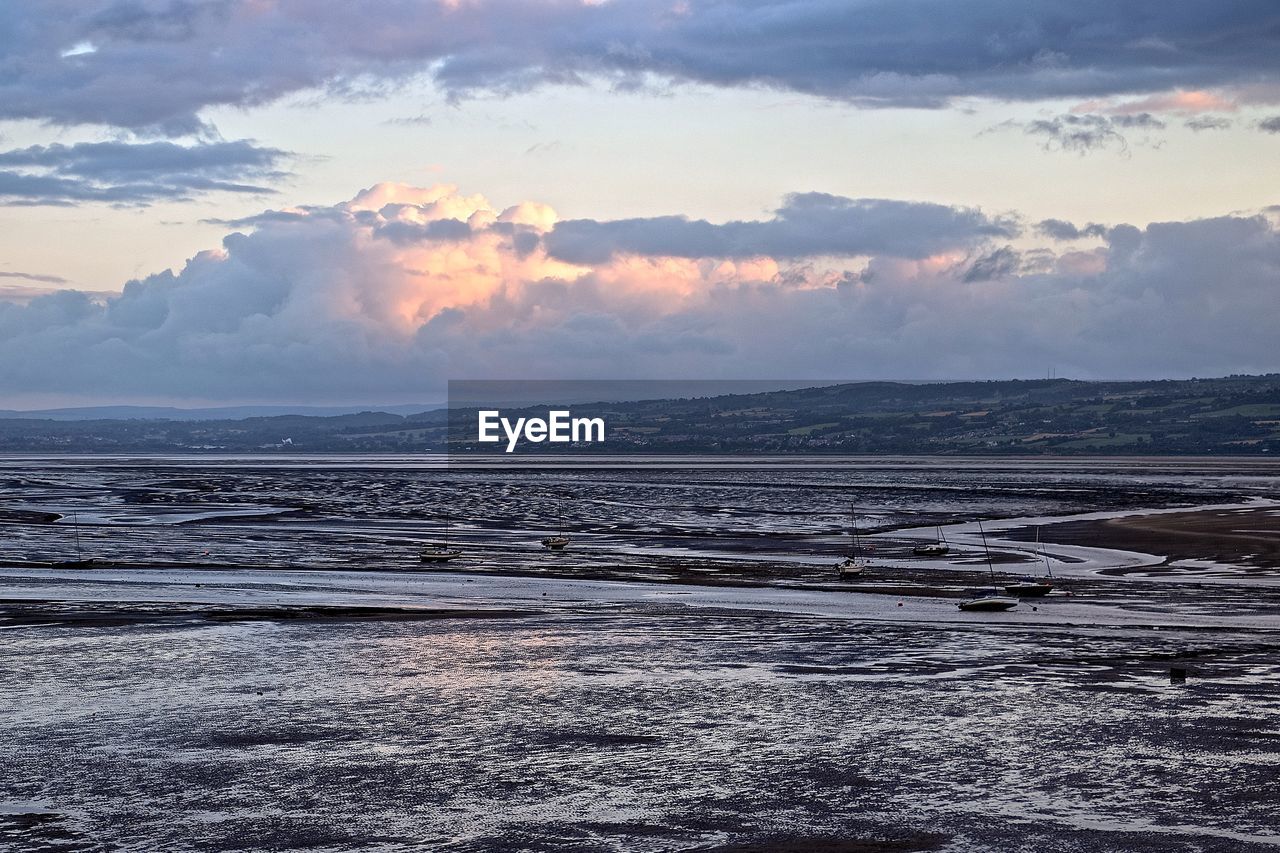 Scenic view of sea against sky at sunset