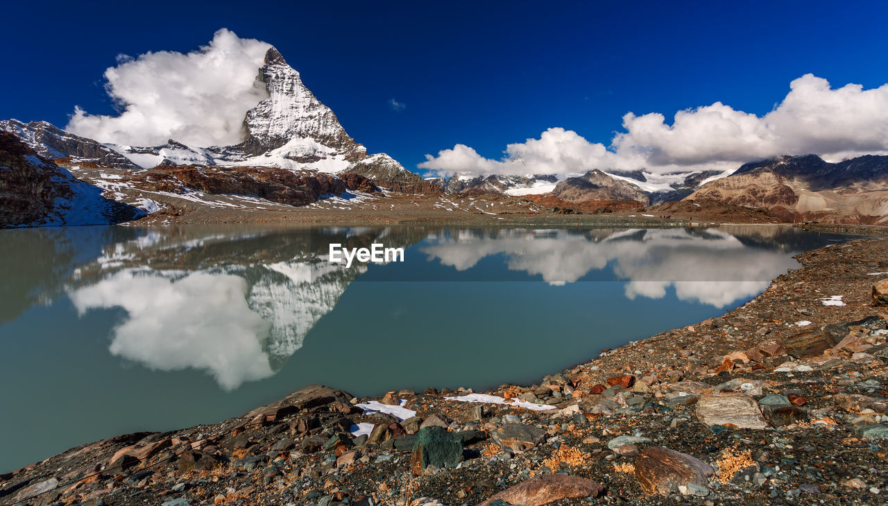 Scenic view of snowcapped mountains against sky