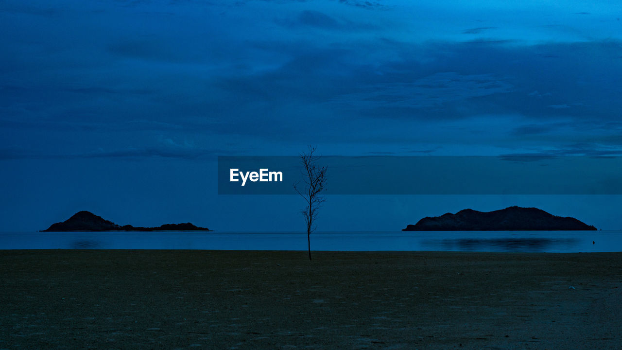 Scenic view of sea against sky at dusk