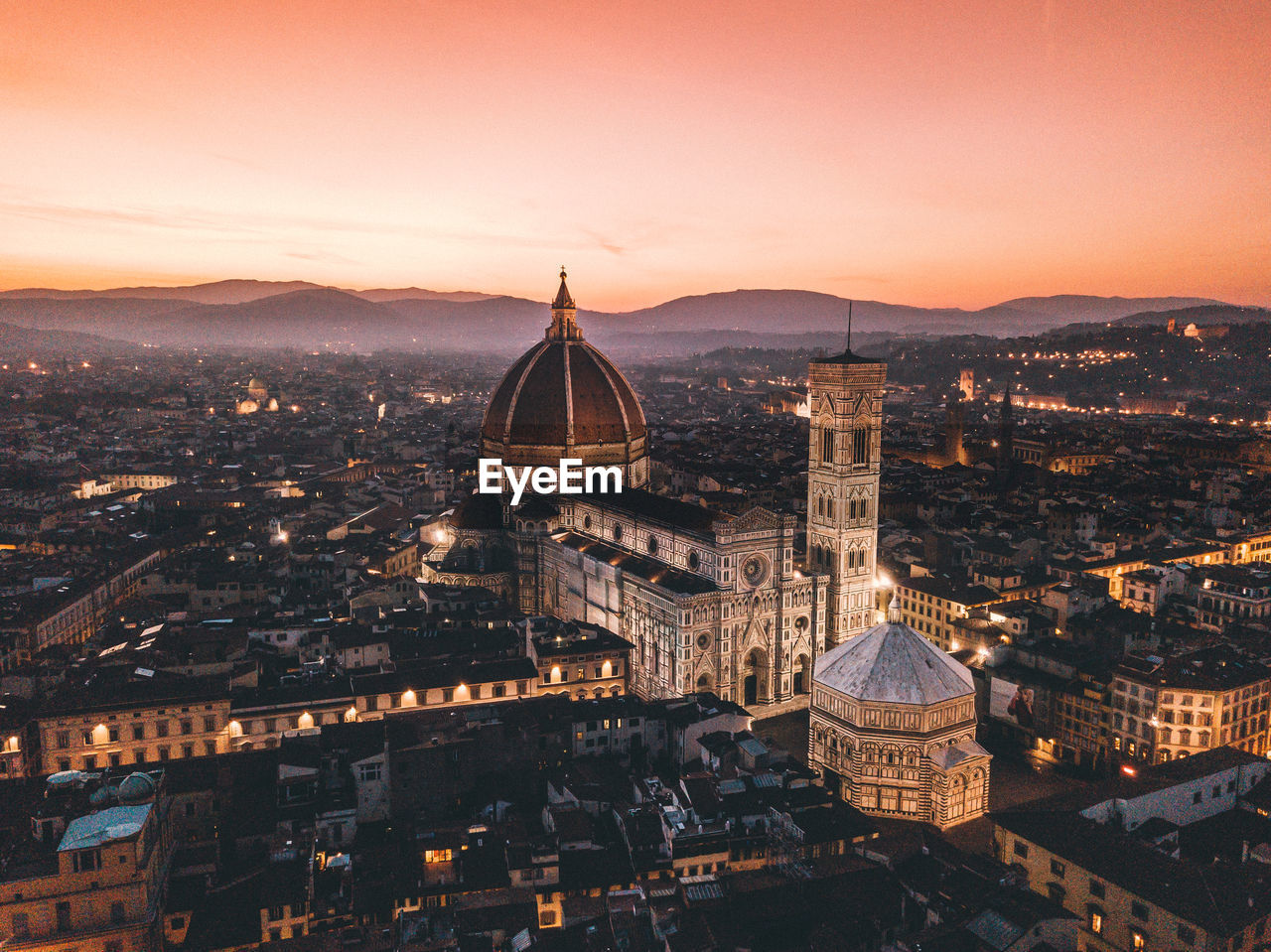 Cathedral and buildings in city against sky