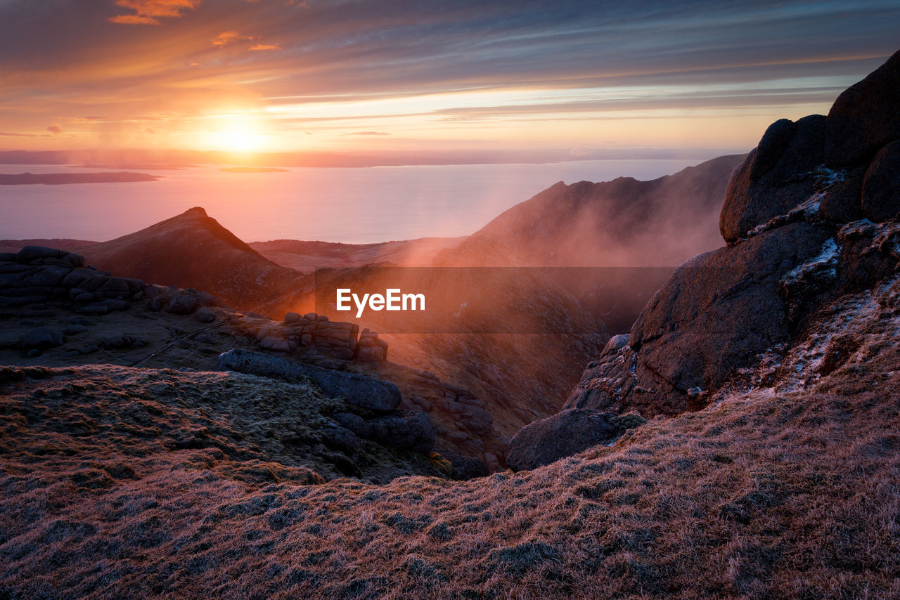 Scenic view of mountains against sky during sunset