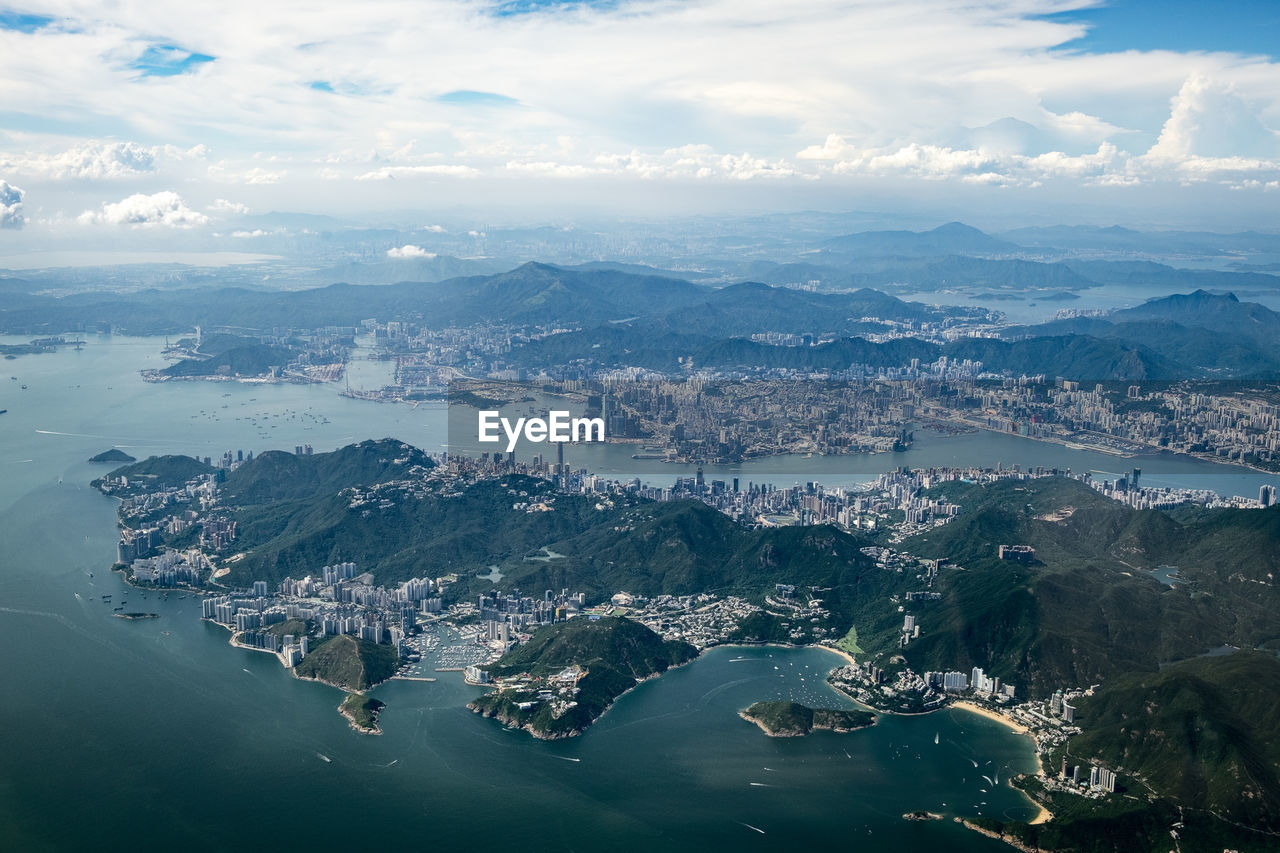 high angle view of sea and mountains against sky