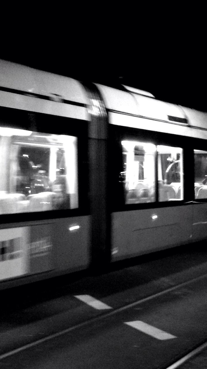 Illuminated train at night