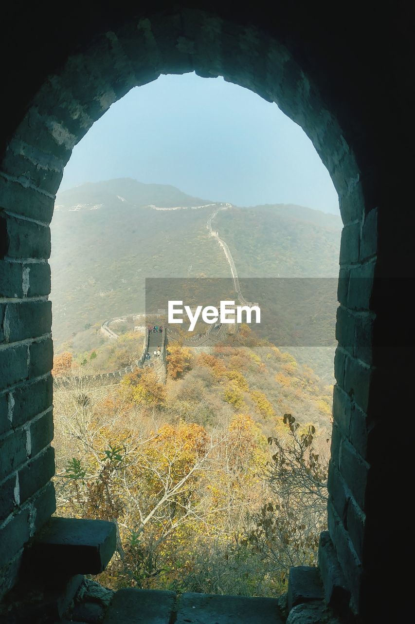 Scenic view of mountain seen through window