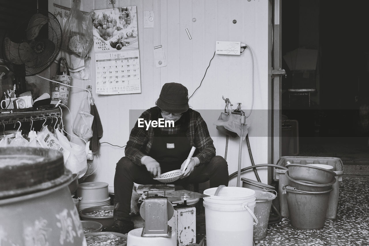 MAN WORKING AT CONSTRUCTION