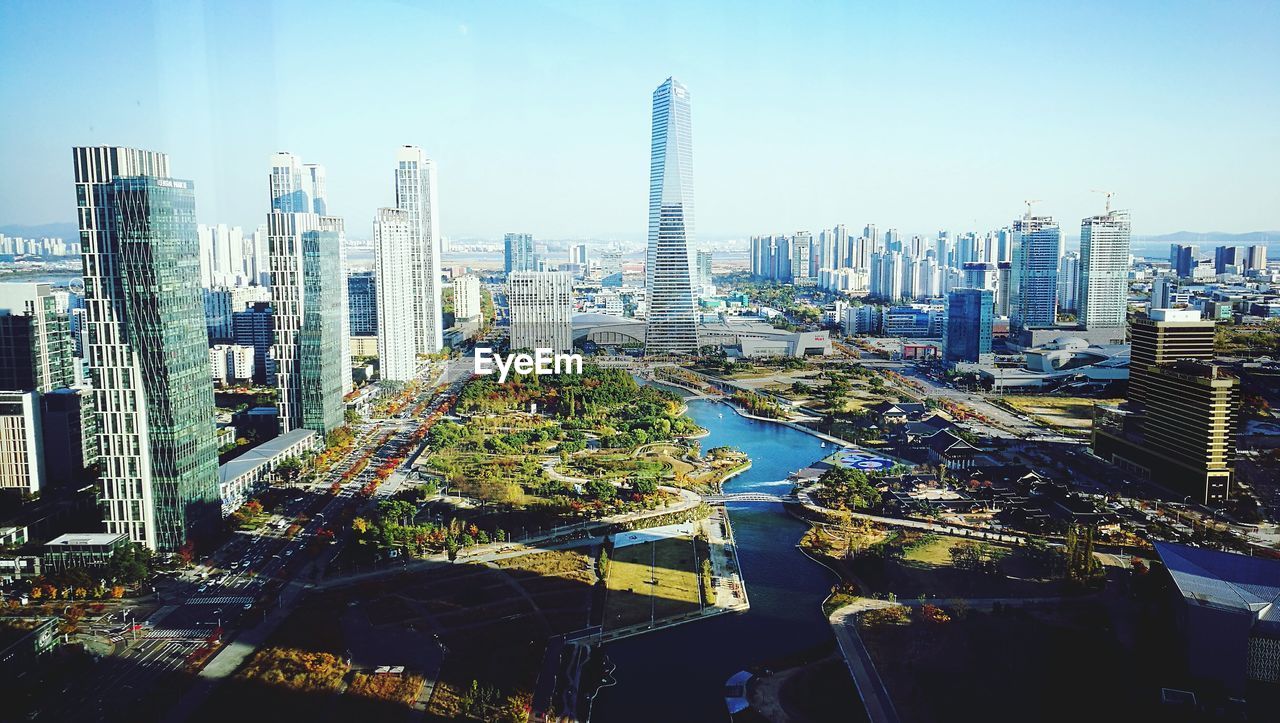 High angle view of buildings in city against sky