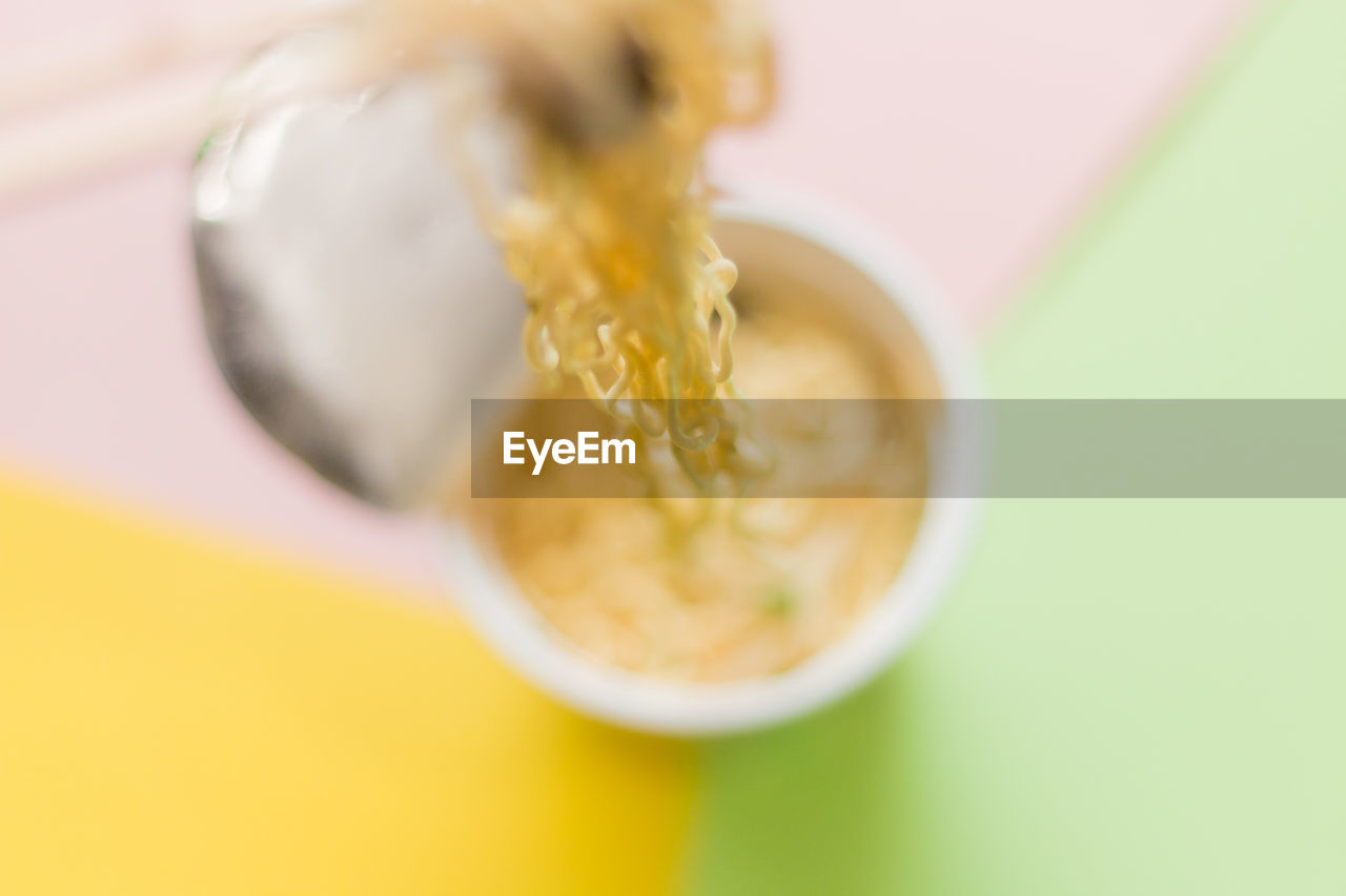 High angle view of noodles in bowl over table