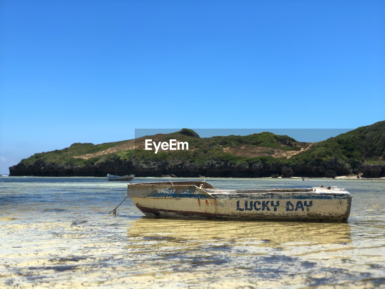 BOAT ON SEA AGAINST CLEAR SKY