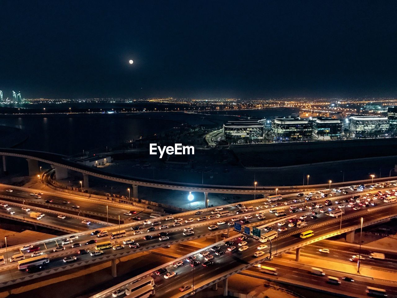 HIGH ANGLE VIEW OF LIGHT TRAILS ON ROAD IN CITY