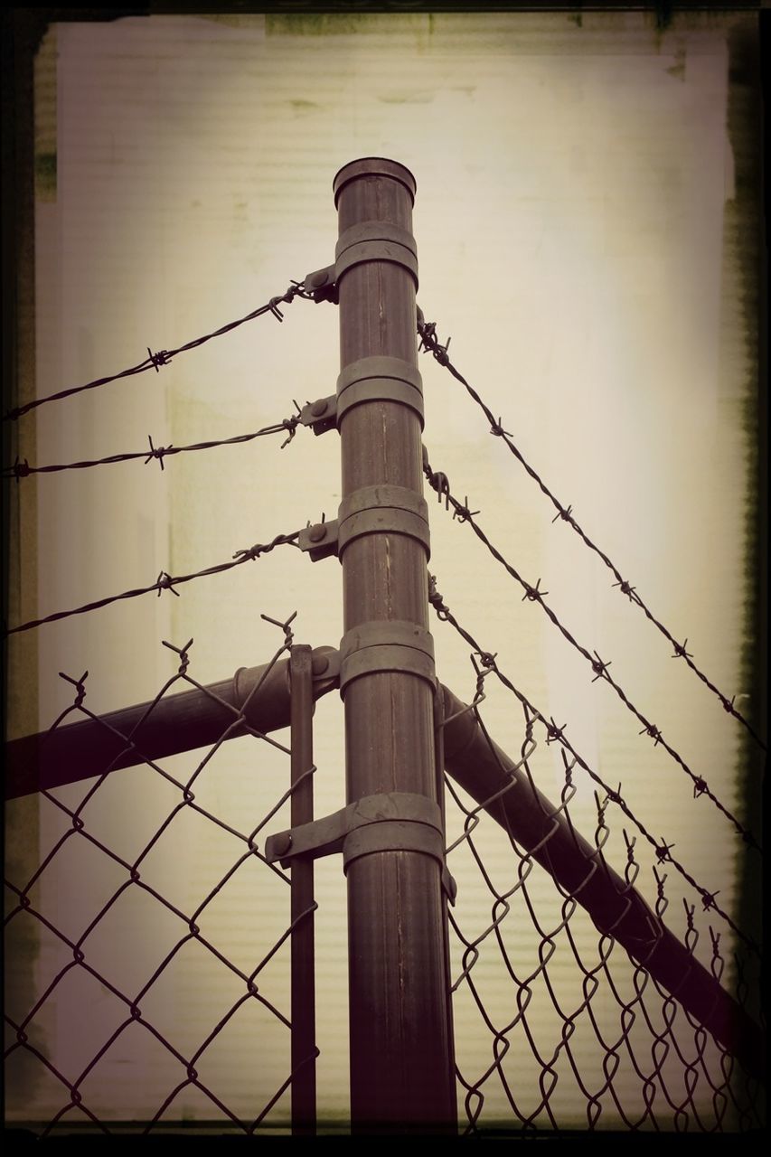 FENCE SEEN THROUGH CHAINLINK FENCE