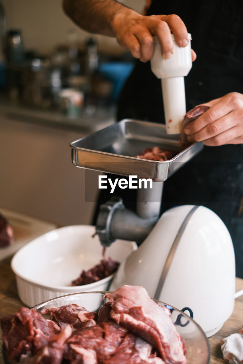 Close-up of man preparing food