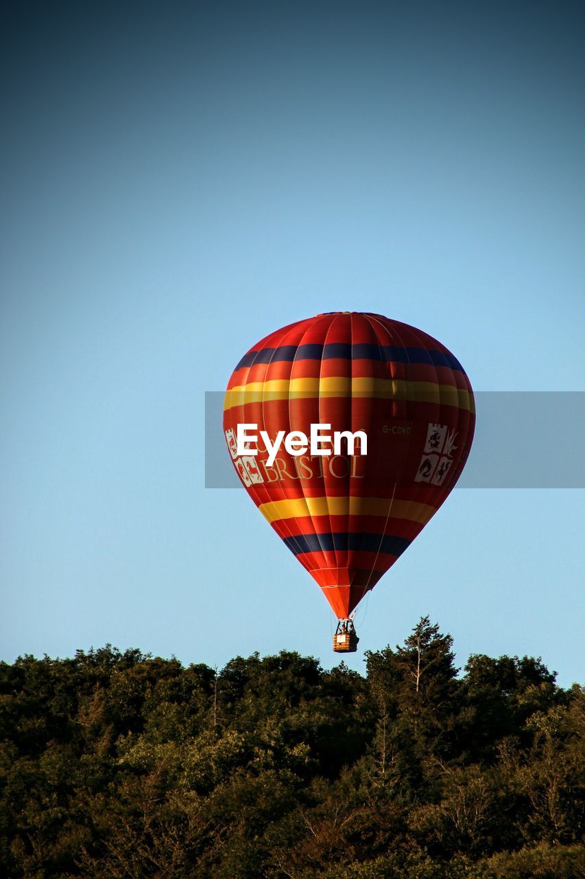 HOT AIR BALLOON FLYING OVER CLEAR SKY