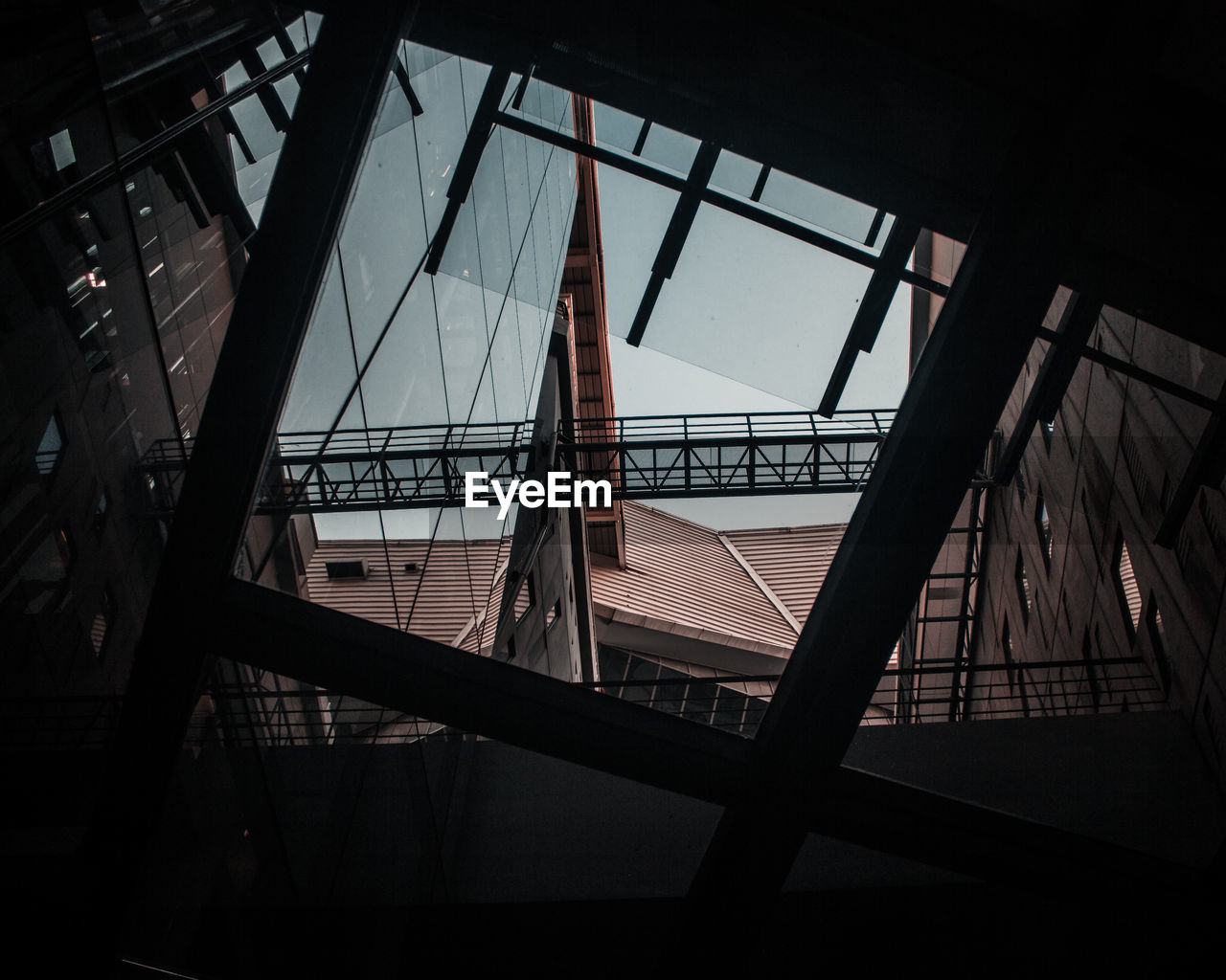 Low angle view of building seen through skylight